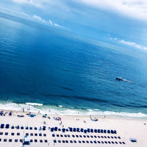 View of the beach and ocean to represent the DEVENEY Tourism and Hospitality Area of Pracice